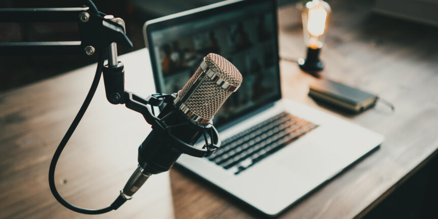 Photo of a mic above a laptop